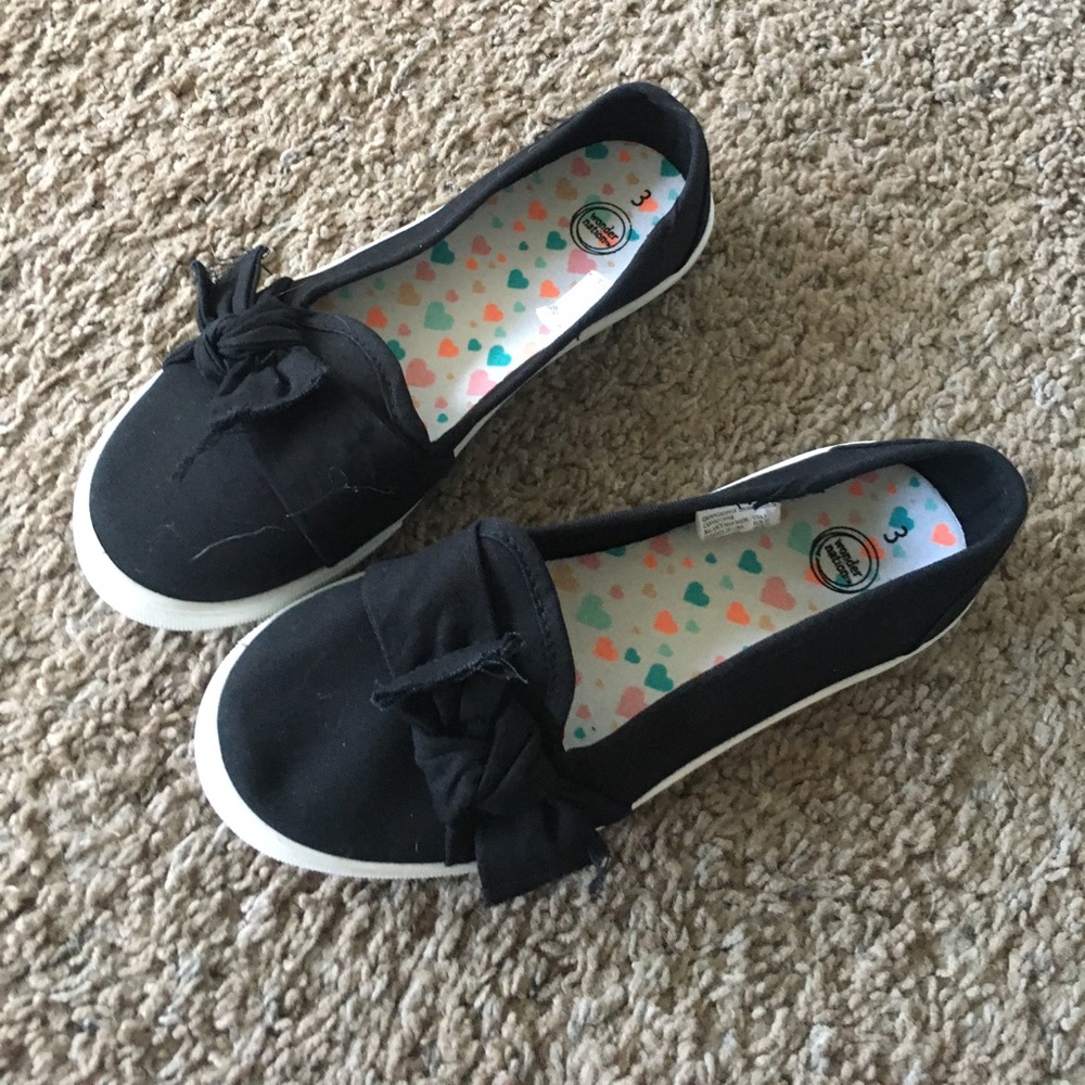 Girls black slip ons